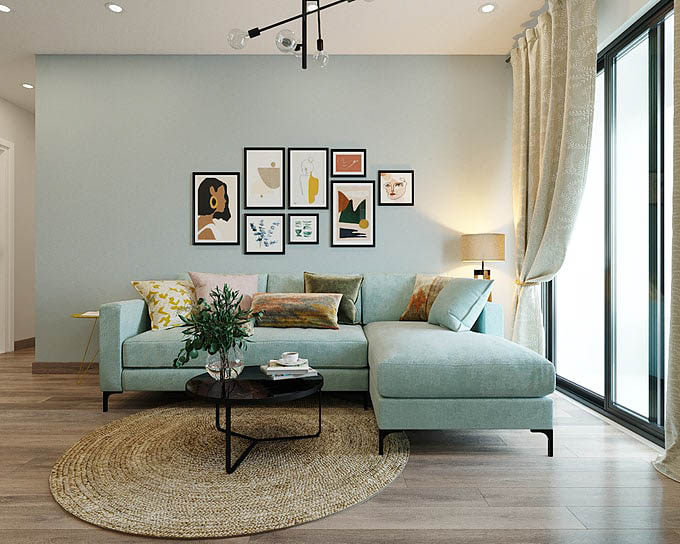 sự đồng bộ giữa màu sơn tường và sofa không bị nhàm chán nhờ sự nhấn nhá của các món phụ kiện nhỏ